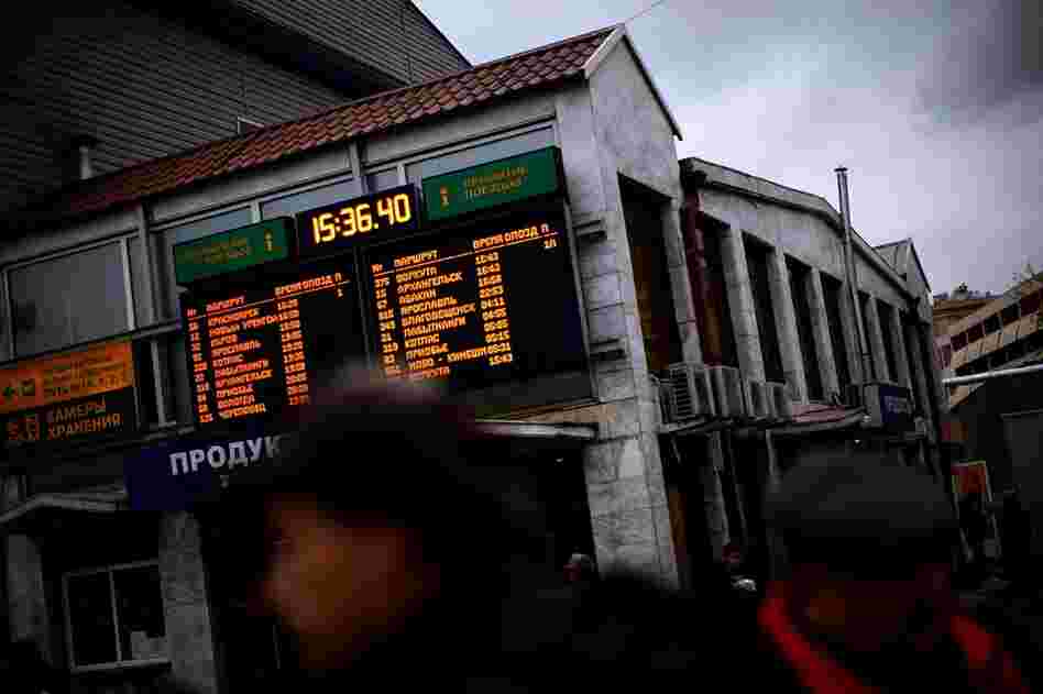Passengers walk past the departing train announcement board at the start of the Trans-Siberian railroad next to the loading platform at the Yaroslavsky Rail Terminal. It is the longest rail line and arguably the most famous, stretching over 9,000 kilometers and spanning 7 time zones.