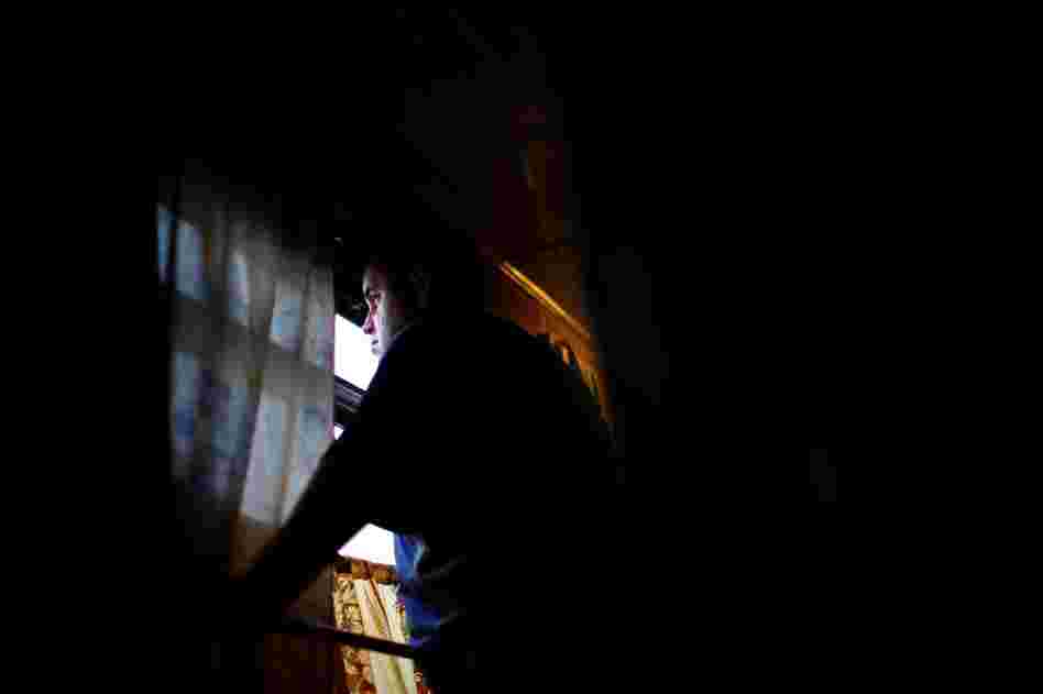 A passenger looks out the window of Train #350 along the Trans-Siberian route.