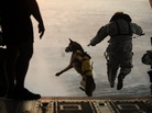 A U.S. Army soldier with the 10th Special Forces Group and his military working dog jump off the ramp of a CH-47 Chinook helicopter from the 160th Special Operations Aviation Regiment during water training over the Gulf of Mexico as part of exercise Emerald Warrior 2011 on March 1, 2011. A U.S. Army soldier with the 10th Special Forces Group and his military working dog jump off the ramp of a CH-47 Chinook helicopter from the 160th Special Operations Aviation Regiment during water training over the Gulf of Mexico as part of exercise Emerald Warrior 2011 on March 1, 2011.