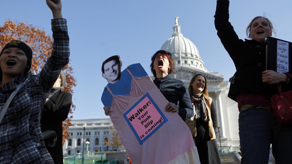 Linda Hedenblad holds a likeness of Wisconsin Gov. Scott Walker at recall rally at the State Capitol in Madison on Nov. 15. 