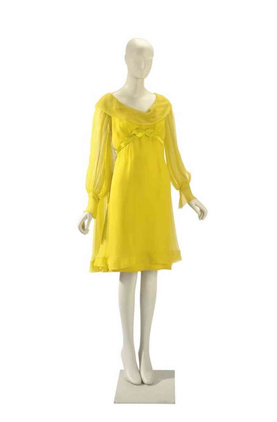 Taylor wore this chiffon dress, designed by Irene Sharaff, for her first wedding to Burton.