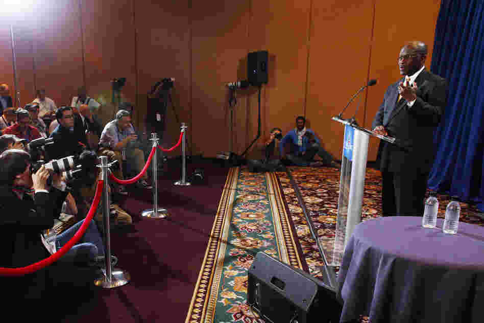 Cain speaks at a Nov. 8 press conference addressing four accusations of sexual harassment. Nearly three weeks later, on Nov. 28, Ginger White also came forward, saying that she and Cain had a consensual 13-year affair. Cain denied any inappropriate behavior. 