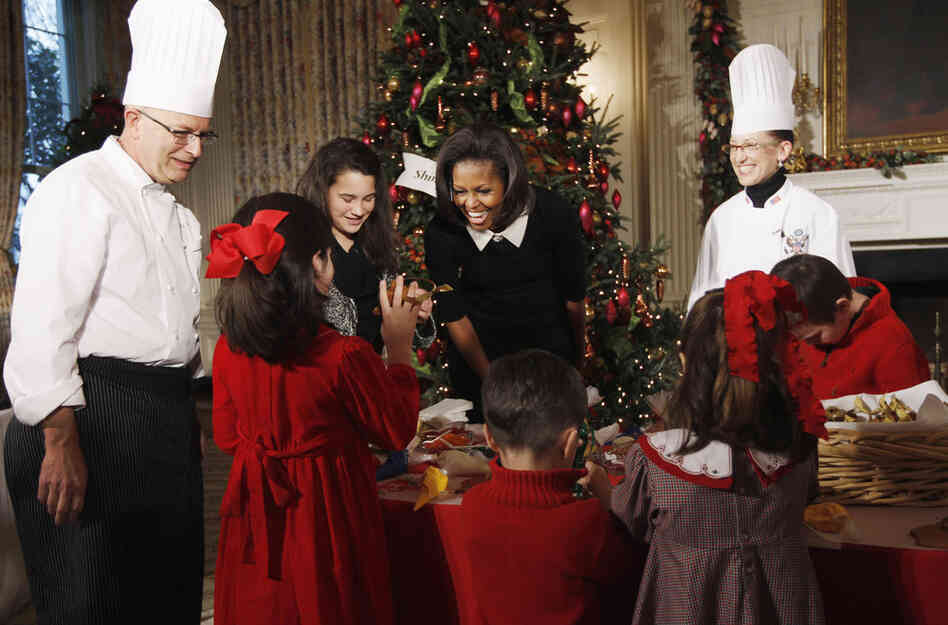 First lady Michelle Obama welcomed military families to the first viewing of the 2011 decorations on Wednesday. White House chefs joined her to decorate cookies with the children. 
