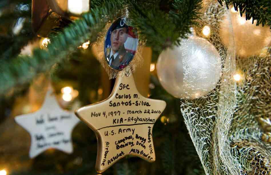 Ornaments made to honor loved ones decorate the Gold Star Families Tree. 