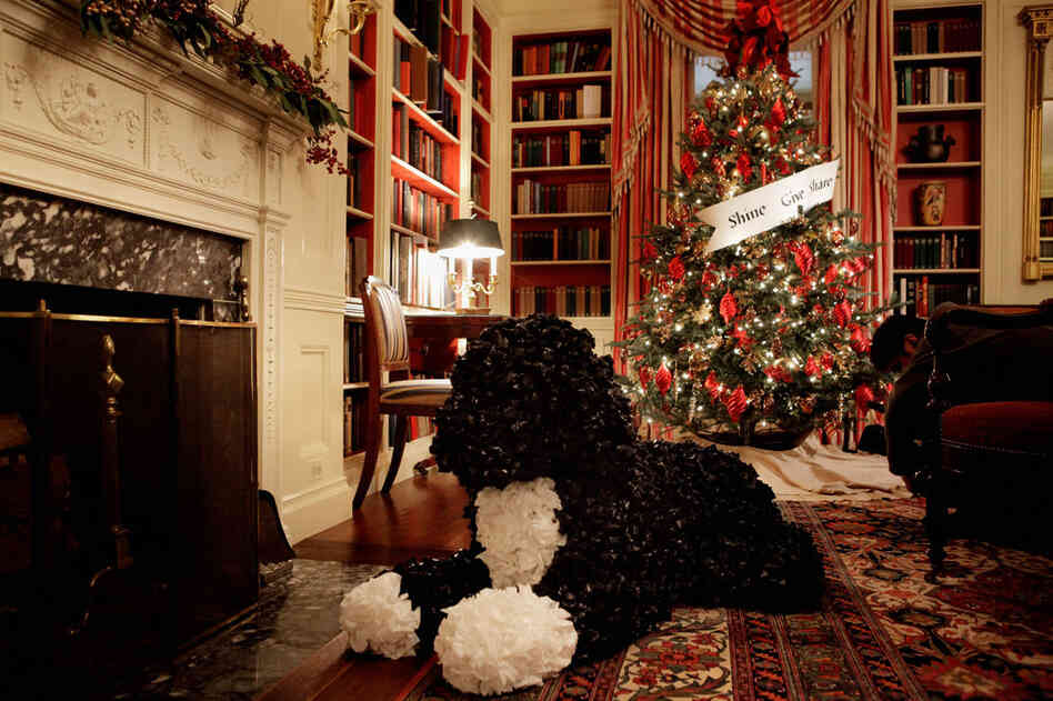 A "Bo" made from plastic garbage bags sits in front of the fireplace in the library. Mrs. Obama drew a laugh from the crowd when she said Bo, "the most famous member of the Obama family," has been a little confused walking around the house and seeing himself in "gigantic form." 