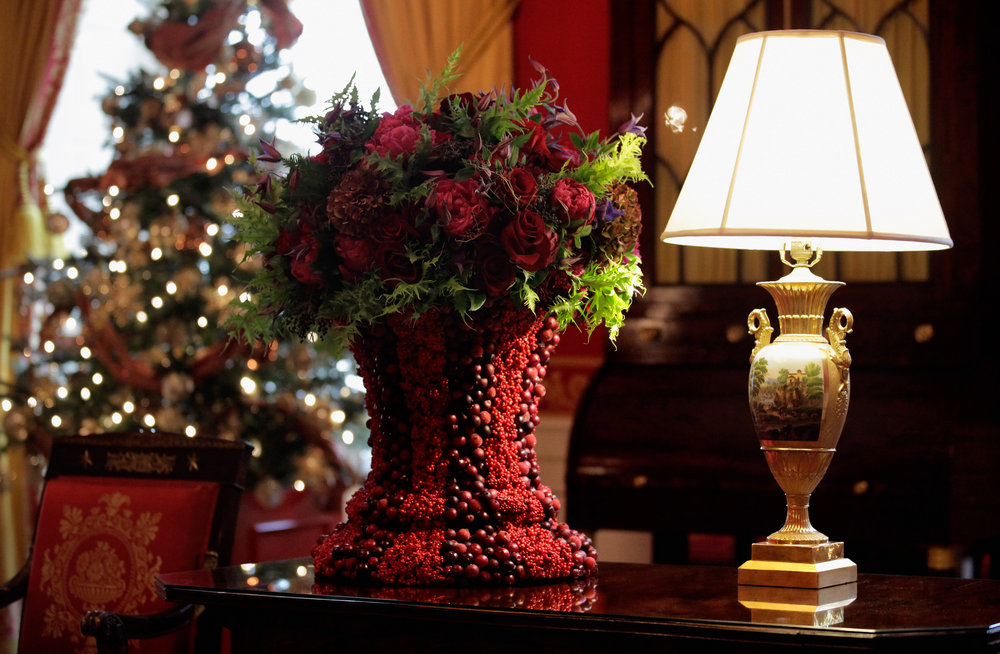 The Red Room features fruit, foliage and flowers set in berry-covered vases. 
