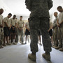 Soldiers pray with a chaplain in Afghanistan. Jason Torpy says military chaplains are assigned many secular advising duties that atheist service members need, too.