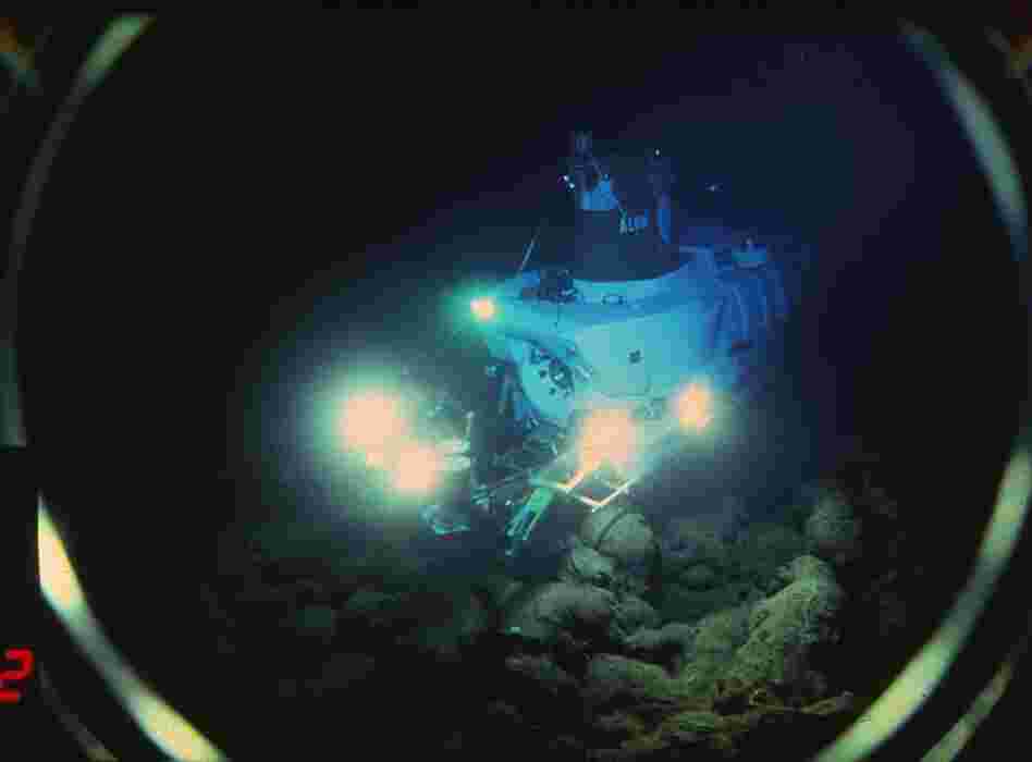 Beneath 8,200 feet of water, the Alvin submarine scopes out the Pacific's seafloor in the 1970s. The geologists aboard weren't searching for life — they were on the hunt for hot spots and undersea thermal vents. 