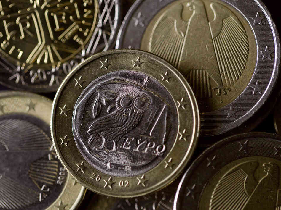 Greek, German, and French euro coins. Greek, German, and French euro coins.