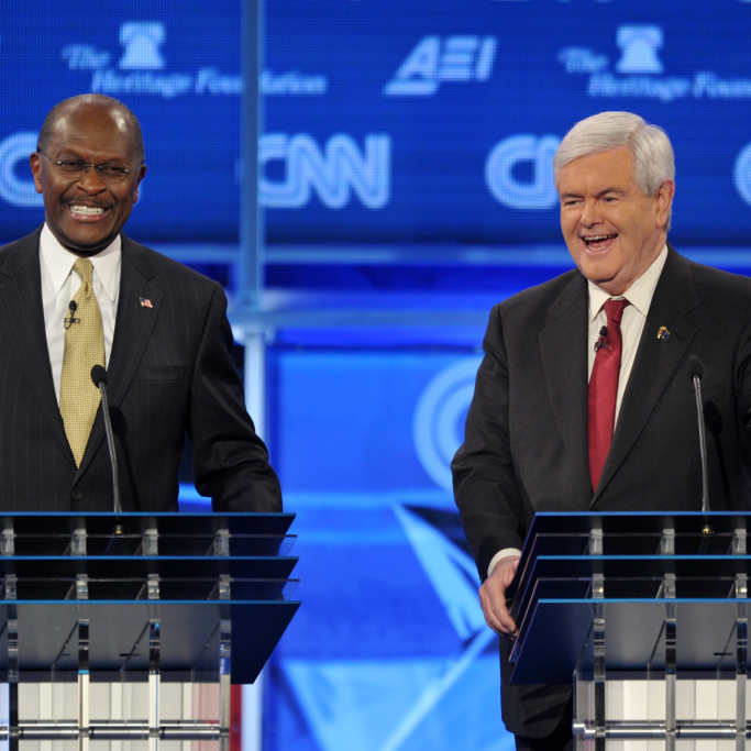 Former House speaker Newt Gingrich (right) and Herman Cain during a Republican presidential debate Nov. 22, 2011, in Washington, D.C.