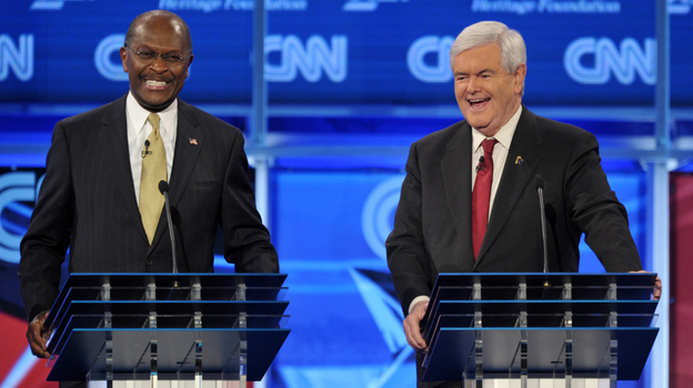 Former House speaker Newt Gingrich (right) and Herman Cain during a Republican presidential debate Nov. 22, 2011, in Washington, D.C.