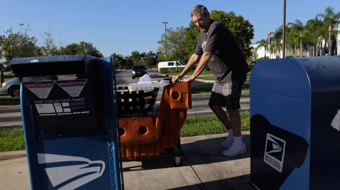 Scott Schechter, a United States Postal Service employee, collected mail from the boxes in front of a mail processing center on Sept. 16, 2011 in Pembroke Pines, Fla. 