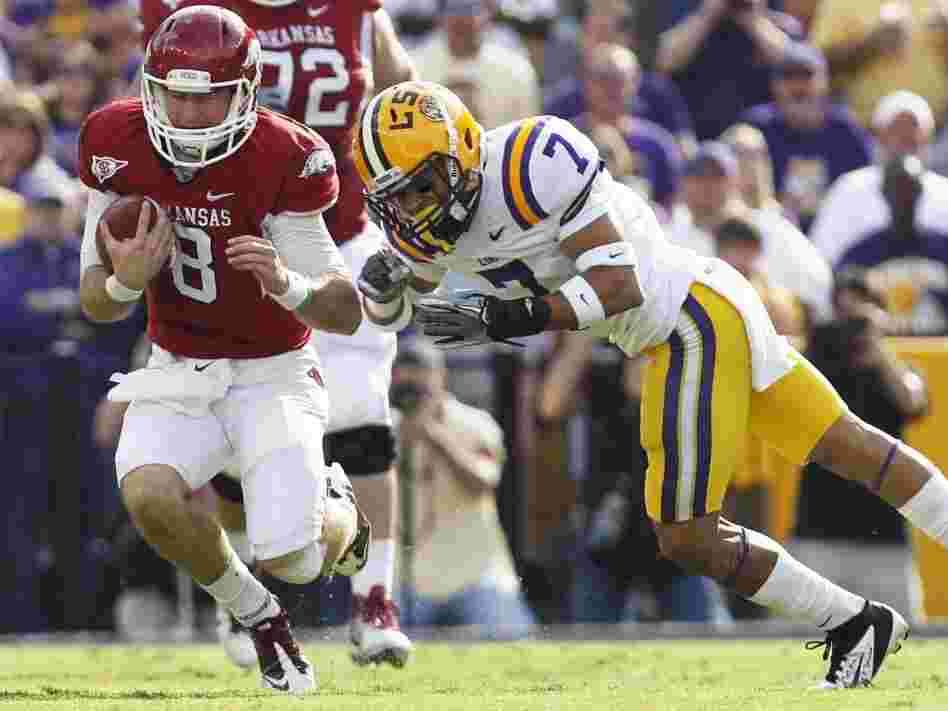 LSU cornerback Tyrann Mathieu (right) earned the nickname "Honey Badger" for hits like this one, against Arkansas quarterback Tyler Wilson on Nov. 25, 2011. Mathieu is one of five finalists named Monday for the Heisman Trophy.