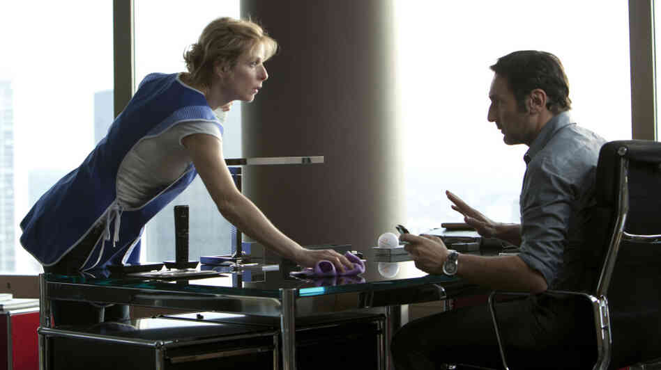 'My Woman-Interpreter': Stephane (Gilles Lellouche) knows the markets, but turns to his lively housekeeper, France (Karin Viard), for perspective on dating — and raising his son. 'My Woman-Interpreter': Stephane (Gilles Lellouche) knows the markets, but turns to his lively housekeeper, France (Karin Viard), for perspective on dating — and raising his son.