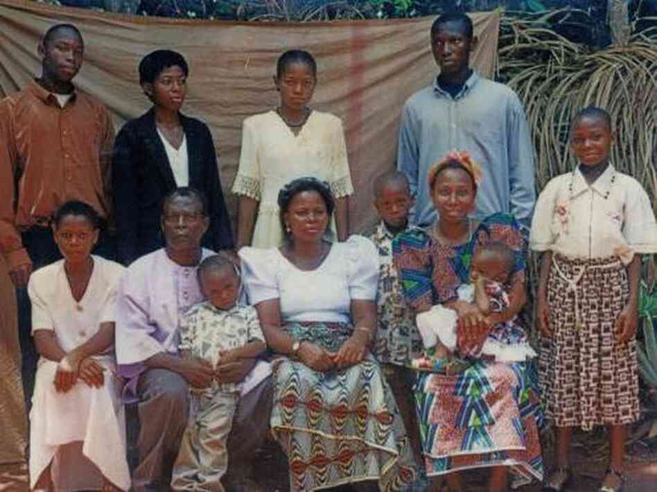 In this family portrait, Chinonye Omeje is standing on the far right, and her mother, Helen, is sitting in the center. In this family portrait, Chinonye Omeje is standing on the far right, and her mother, Helen, is sitting in the center.