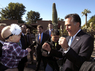 Mitt Romney entertains a toddler in Paradise Valley, AZ, Tuesday, Dec. 6, 2011. Mitt Romney entertains a toddler in Paradise Valley, AZ, Tuesday, Dec. 6, 2011.