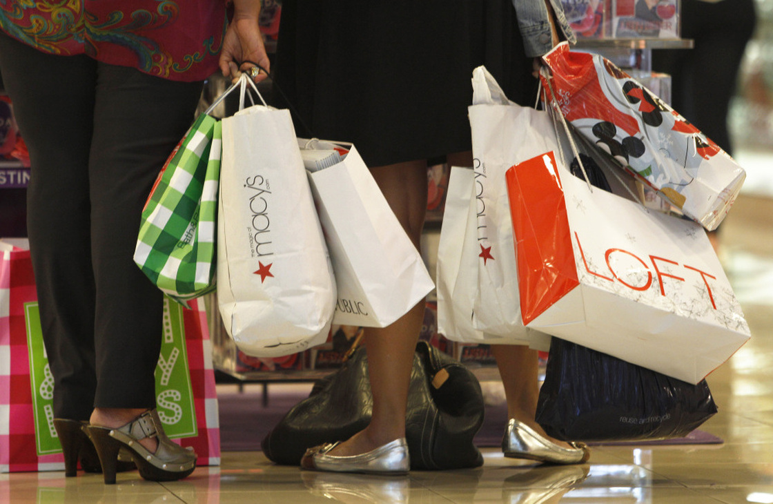 Shoppers look at a display at the Dadeland Mall in Miami on Nov. 25. Princeton professor Sheldon Garon says Americans spend too much and save too little compared to Europeans and Asians. 