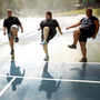 Wellspring students do high steps on the tennis court. Exercise is paramount at Wellspring, and a little rain doesn't get in the way of outdoor activities.