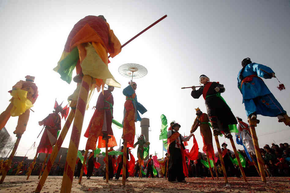 Villagers stilt walk during Shehuo celebrations in China's Qinghai Province in 2009. 