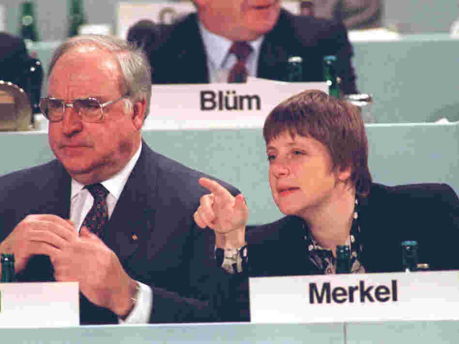 In an undated photo from the early 1990s, Merkel, then Germany's minister for women and youth, is shown beside Chancellor Helmut Kohl. Unlike Kohl, Merkel did not live through World War II and was not shaped by history in the same way as her predecessor.