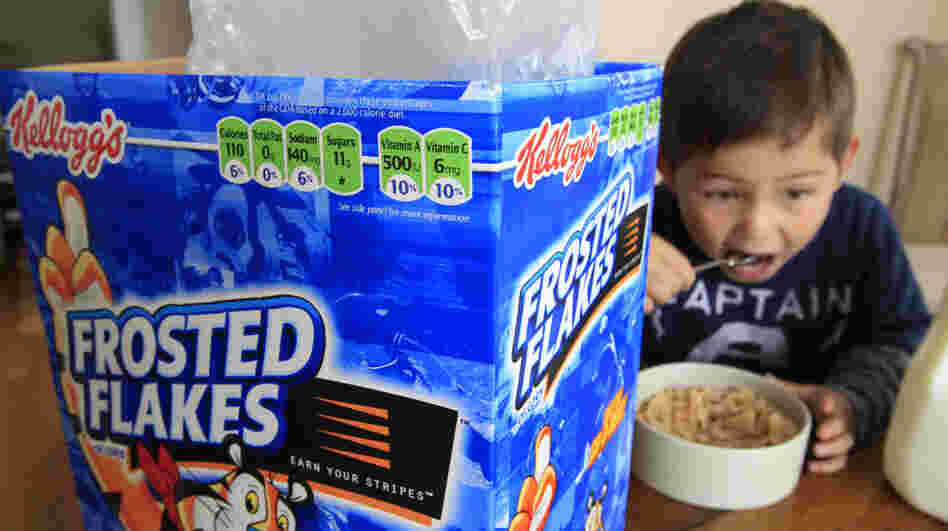 Nathaniel Donaker, 4, eats Kellogg's Frosted Flakes cereal at his home in Palo Alto, Calif. Frosted Flakes is 27 percent sugar, according to a report by the Environmental Working Group.