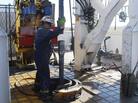 A worker at Encana's Frenchie Draw gas-drilling rig in central Wyoming guides sections of steel pipe into an 11,000-foot well in 2009. The EPA on Thursday has tied contamination in drinking water to chemicals used in the drilling technique, called hydraulic fracturing, or "fracking." A worker at Encana's Frenchie Draw gas-drilling rig in central Wyoming guides sections of steel pipe into an 11,000-foot well in 2009. The EPA on Thursday has tied contamination in drinking water to chemicals used in the drilling technique, called hydraulic fracturing, or "fracking."