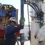  A worker at Encana's Frenchie Draw gas-drilling rig in central Wyoming guides sections of steel pipe into an 11,000-foot well in 2009. The EPA on Thursday has tied contamination in drinking water to chemicals used in the drilling technique, called hydraulic fracturing, or "fracking." 