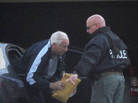 Former Penn State assistant football coach Jerry Sandusky, center, gets out of a car in front of his home on Thursday after he was released from jail. Former Penn State assistant football coach Jerry Sandusky, center, gets out of a car in front of his home on Thursday after he was released from jail.