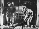 Rescue workers carry a hospital bed through a flooded corridor at Hartford Hospital in 1961. Rescue workers carry a hospital bed through a flooded corridor at Hartford Hospital in 1961.