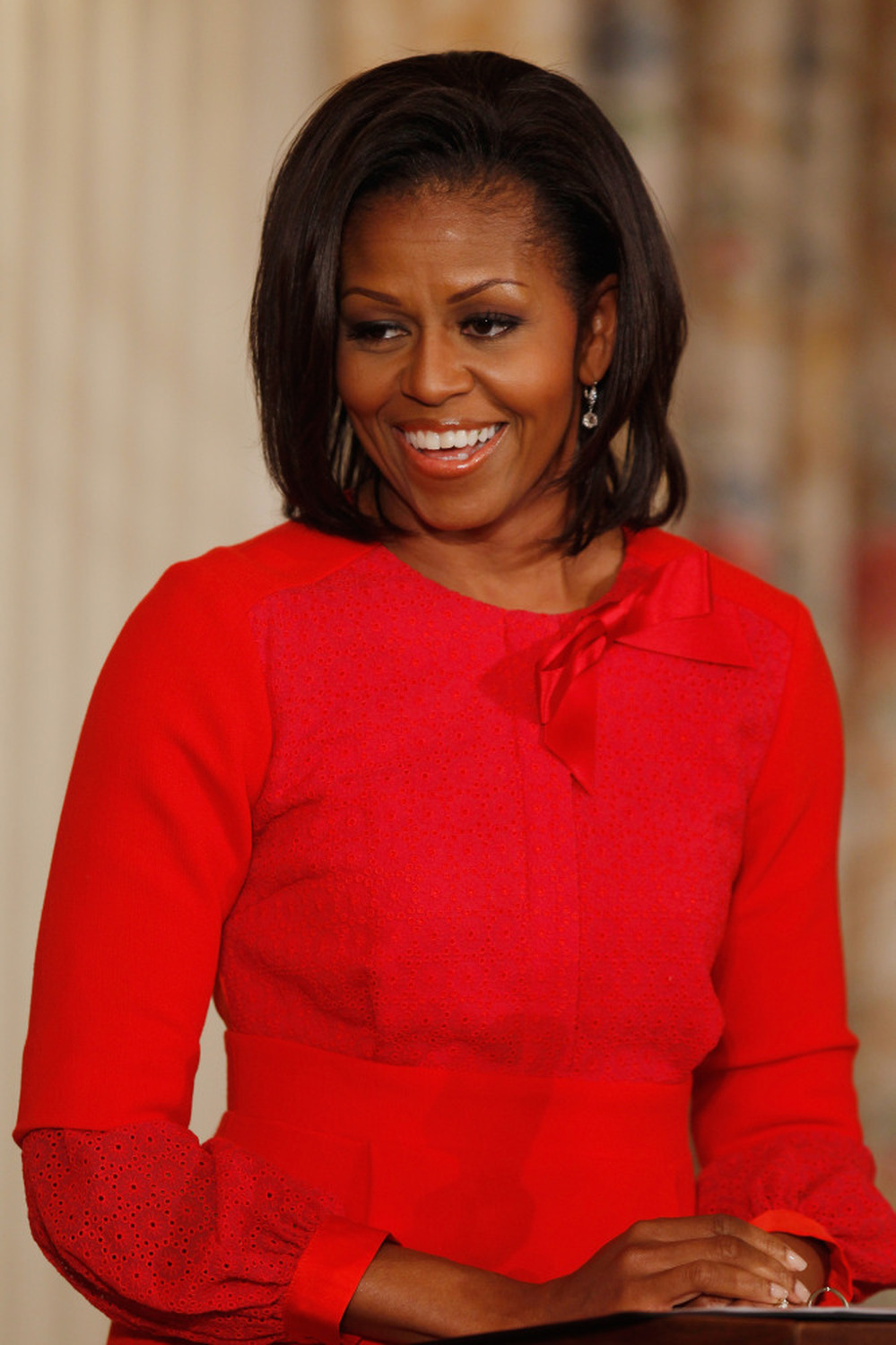 Michelle Obama shines in vivid red. 
