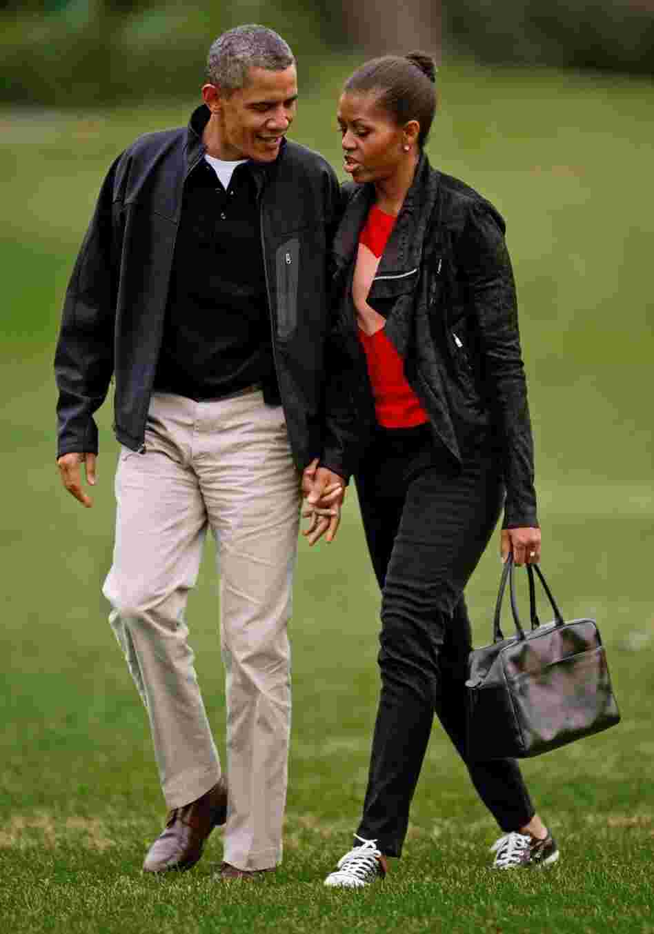 Michelle Obama sports casual skinny black pants and a matching jacket. 