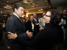 Republican presidential candidate Texas Gov. Rick Perry talks with voter Jane High before speaking at the Scott County Republican party's Ronald Reagan Dinner on Nov. 14 in Bettendorf, Iowa. Republican presidential candidate Texas Gov. Rick Perry talks with voter Jane High before speaking at the Scott County Republican party's Ronald Reagan Dinner on Nov. 14 in Bettendorf, Iowa.
