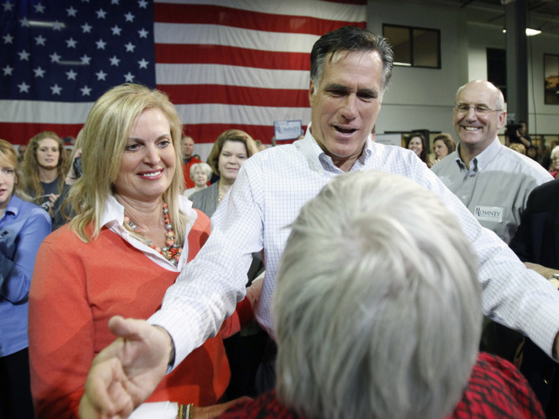 Republican presidential candidate Mitt Romney and his wife, Ann, greet crowd members while campaigning Friday in Marion, Iowa.