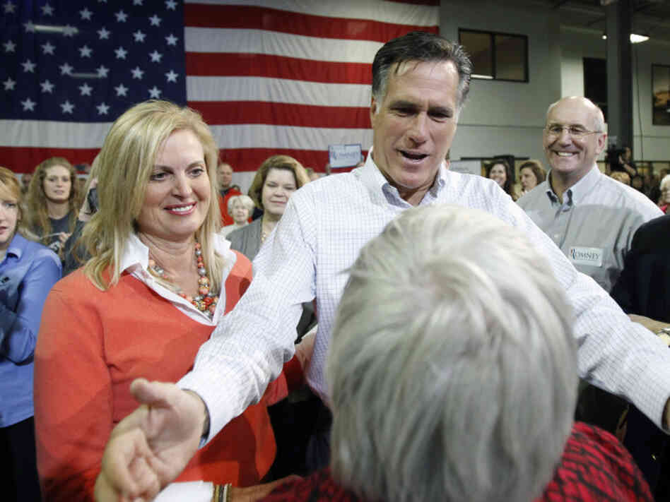 Republican presidential candidate Mitt Romney and his wife, Ann, greet crowd members while campaigning Friday in Marion, Iowa.