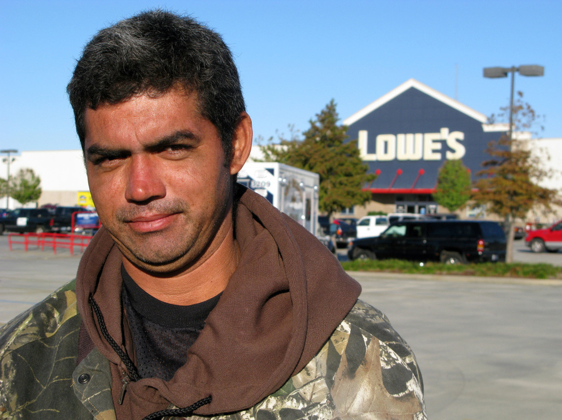 Day laborer Yohanni Castillo from Honduras waits for work outside a Lowes home improvement store in New Orleans. Jobs are drying up, he says, and he hasn't worked in four days. Even when work does comes along, he says, he doesn't always get paid.