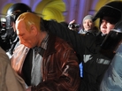 Riot police officers detain a man in a mask depicting Russia's Prime Minister Vladimir Putin during an opposition protest in St. Petersburg on Thursday. Riot police officers detain a man in a mask depicting Russia's Prime Minister Vladimir Putin during an opposition protest in St. Petersburg on Thursday.