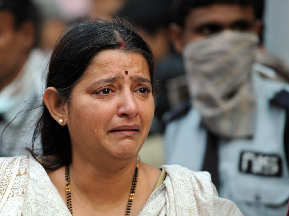 A grieving woman at the scene of today's fire in Kolkata.