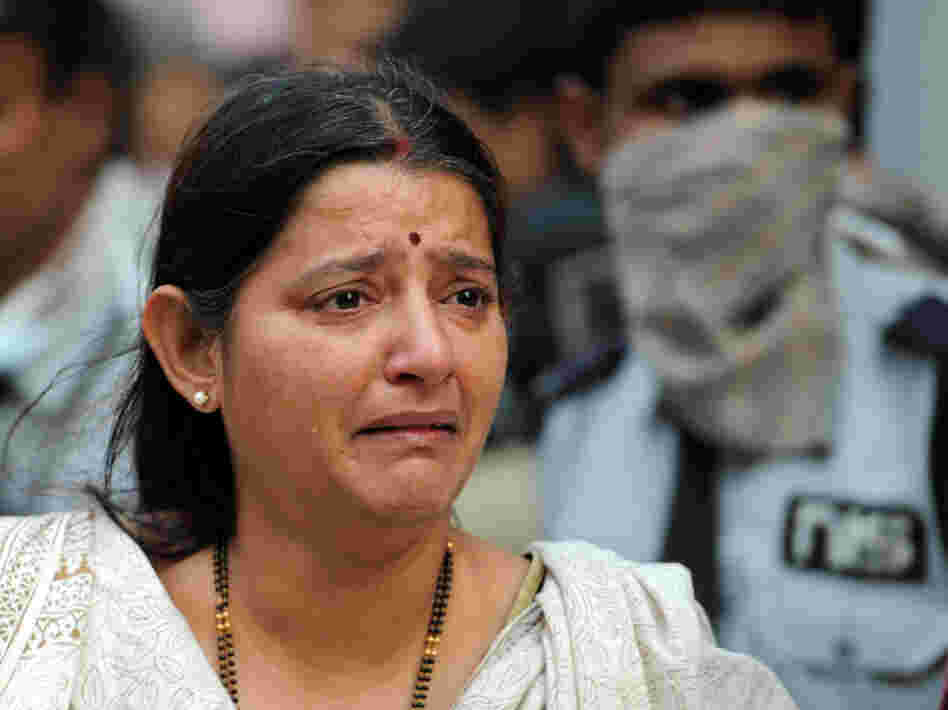 A grieving woman at the scene of today's fire in Kolkata.