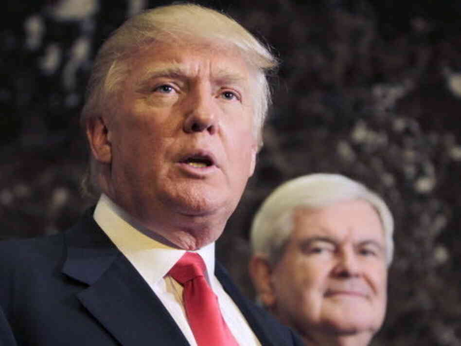 Republican presidential candidate, former House Speaker Newt Gingrich listens at right as Donald Trump talks to media after a meeting in New York. Republican presidential candidate, former House Speaker Newt Gingrich listens at right as Donald Trump talks to media after a meeting in New York.