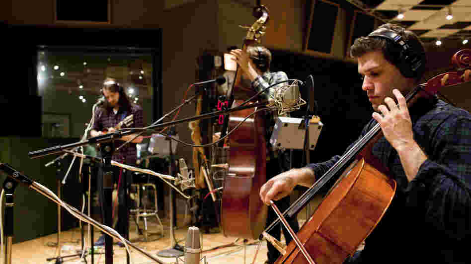 Josh Hirshfeld (mandolin), Evan Younger (double bass) and Geoff McDonald (cello) of Miracles of Modern Science settle into NPR's Studio 4A.