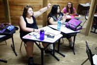 Academics are rigorous at Wellspring. Here, students sit in a math class on campus. With a maximum campus enrollment of 50 students, class size is generally very small.