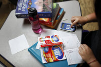 Savannah Davis calculates her calorie and fat intake during a free moment.