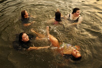 Wellspring students go for a swim in the lake just before sunset.