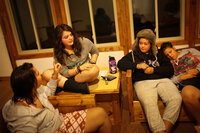 Bethany Gomez (from left), Ana Pierdant, Rachel Fujiyoshi and Jessica Wiegel swap stories and paint fingernails in their dorm before lights out.
