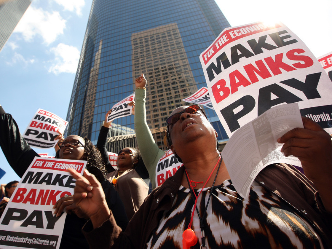 LOS ANGELES, CA - OCTOBER 6: Protesters march on downtown banks in Los Angeles, California. (Photo by David McNew/Getty Images)
