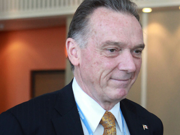Canadian Environmental Affairs Minister Peter Kent leaves a closed-door meeting on the final day of negotiations of the United Nations Framework Convention on Climate Change (UNFCCC) in Durban on Saturday.