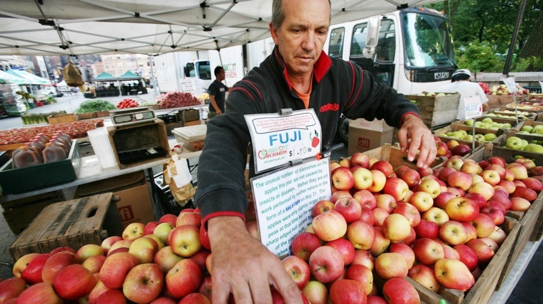 Americans are craving food grown locally: There are now more than 6,000 farmers markets across the country. Here Ron Samascott organizes apples from his orchard in Kinderhook, N.Y., at the Union Square Greenmarket in New York.