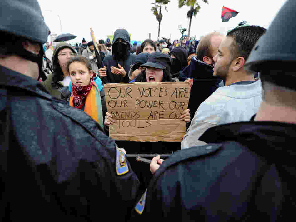 Occupy protesters clash with Long Beach Police Department officers after blocking the road leading to SSA Marine, a shipping company that is partially owned by investment bank Goldman Sachs, at the Port of Long Beach on Monday.