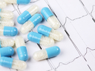 Capsules on an electrocardiogram printout. Capsules on an electrocardiogram printout.
