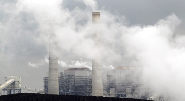 Piles of coal are shown at NRG Energy's W.A. Parish Electric Generating Station in Thompsons, Texas. The U.S. Environmental Protection Agency will begin regulating mercury emissions from coal-fired power plants for the first time.